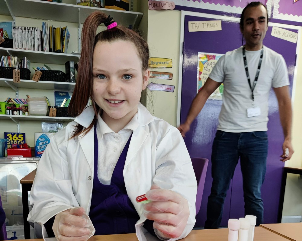 Pupil at Four Acres Academy learning about how PCR testing works to diagnose for COVID-19